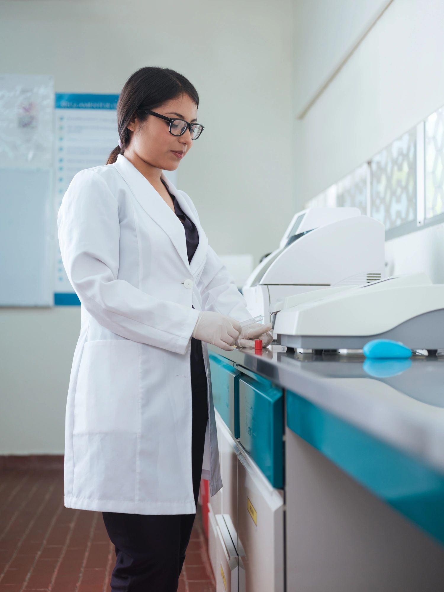 Optical imaging specialist working with advanced medical technology in a laboratory